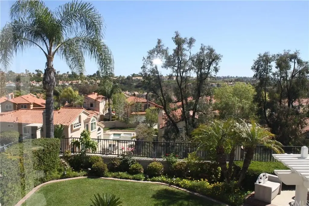 Residential area with houses, trees, and greenery