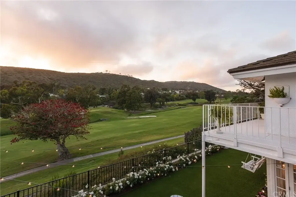 Balcony of house California real estate overlooking golf course and hills.