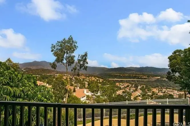 Scenic view of rolling hills and a residential area.