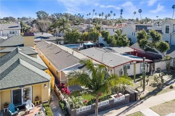 Aerial view of California real estate houses with palm trees and pools